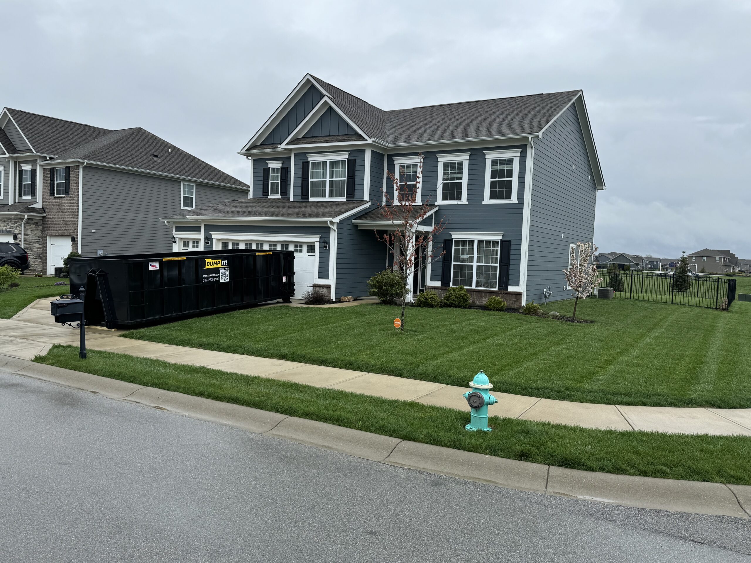 dumpster in front of residential home